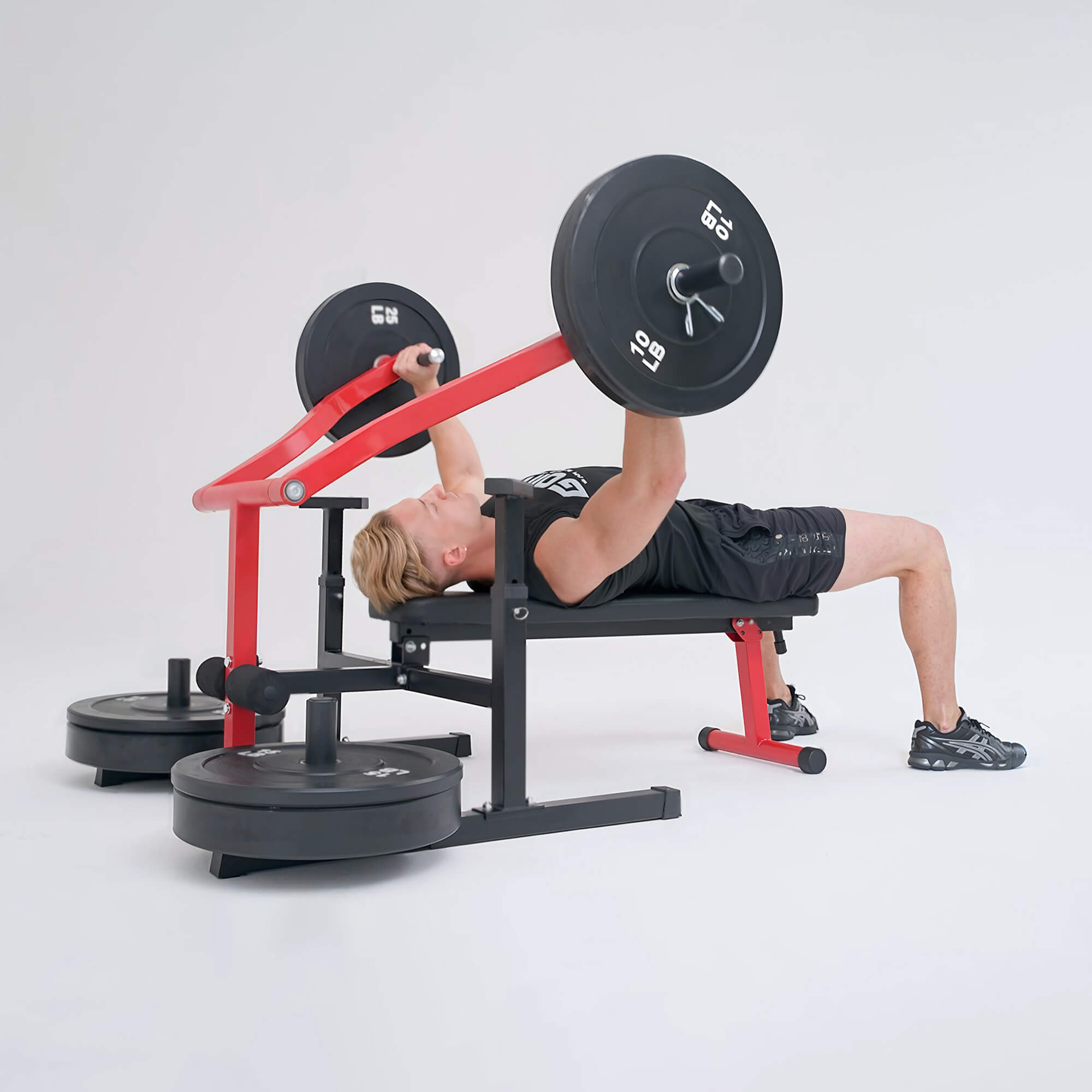 Person using a weight bench with weights on a white background.#color_red