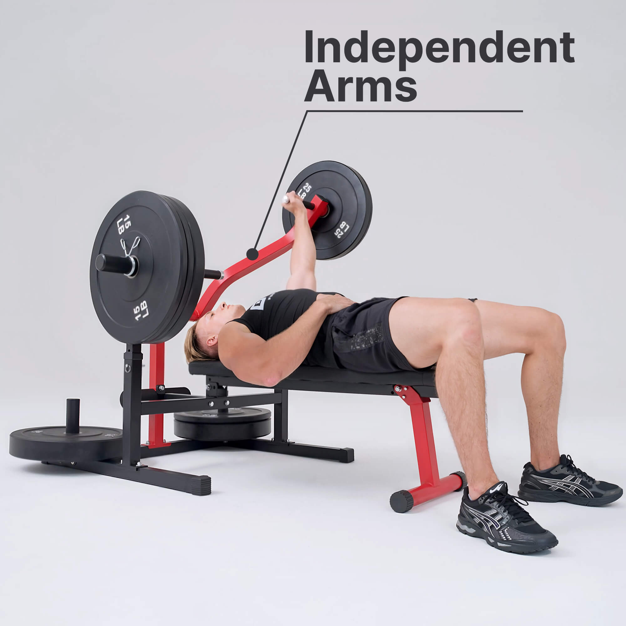 Person using a weight bench with independent arms on a gray background.#color_red