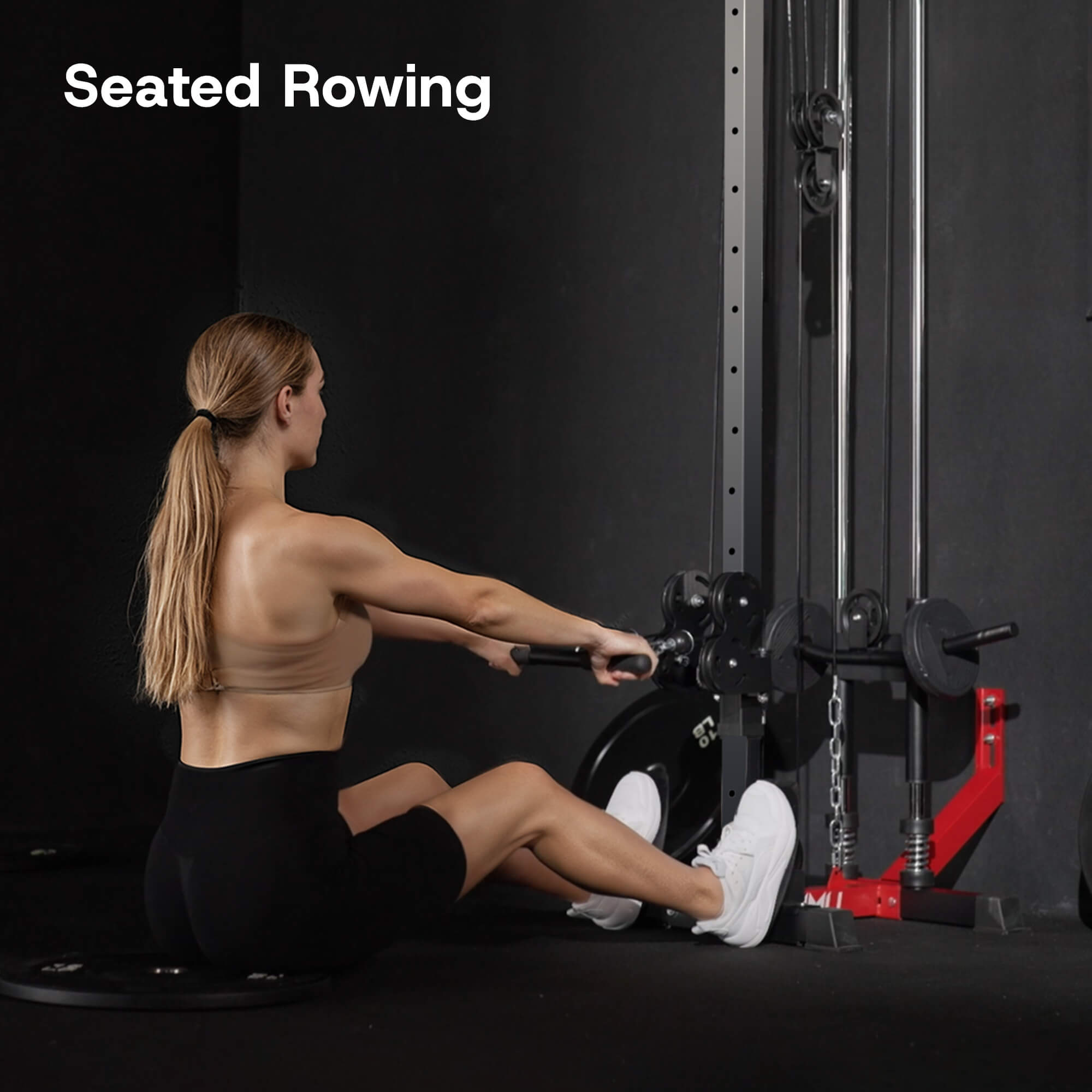 Person using a seated rowing machine with 'Seated Rowing' text above.