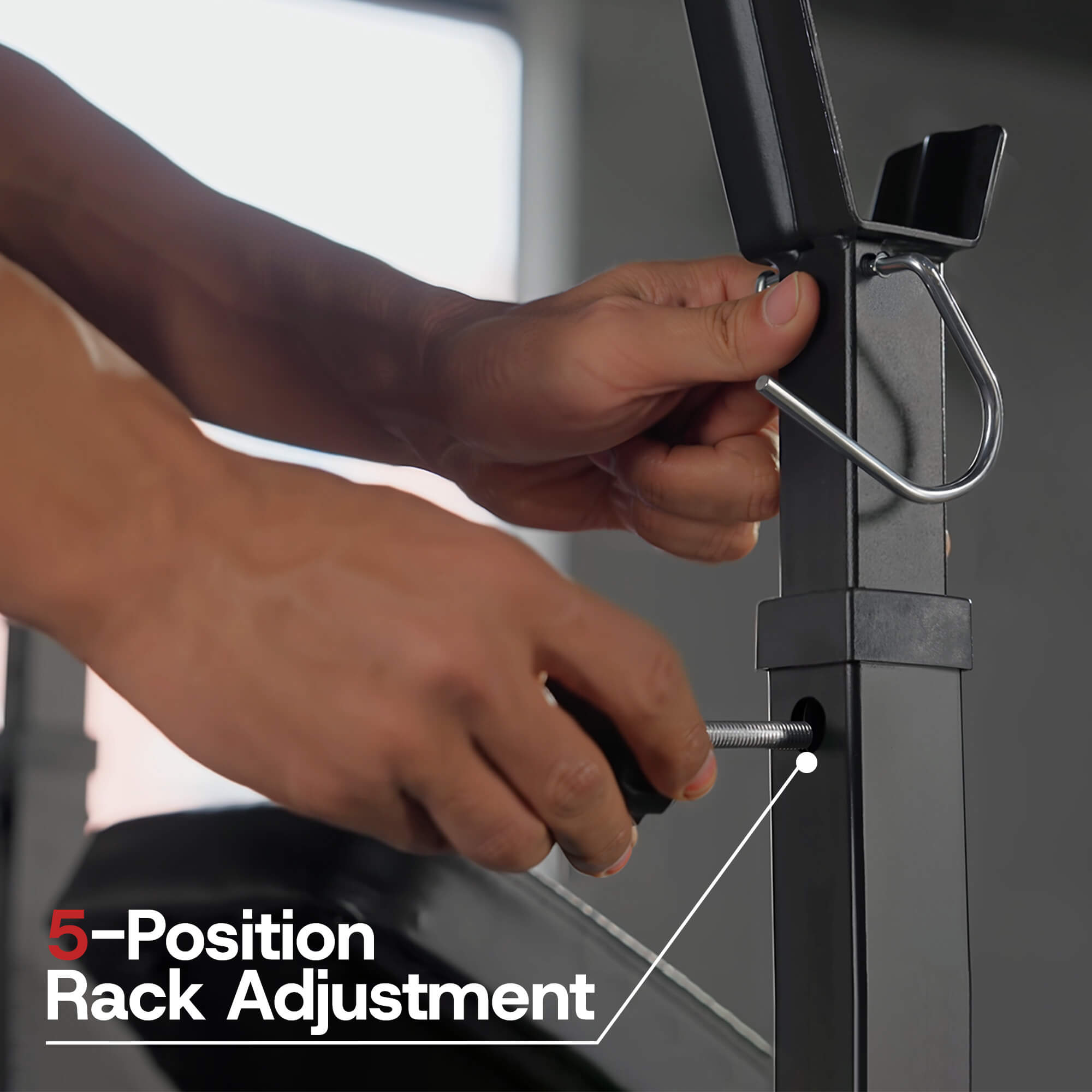 Person adjusting a weight rack with text '5-Position Rack Adjustment' on a blurred background.