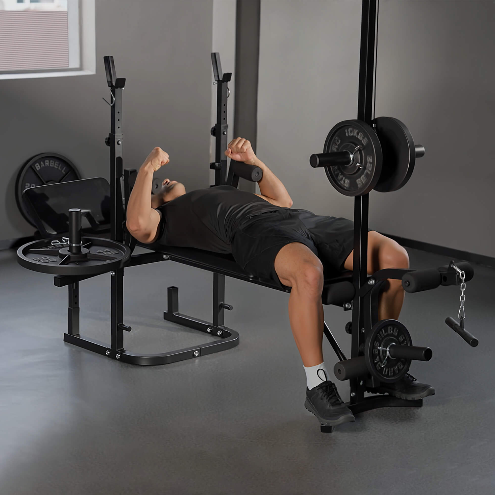 Person using a weight bench in a gym setting