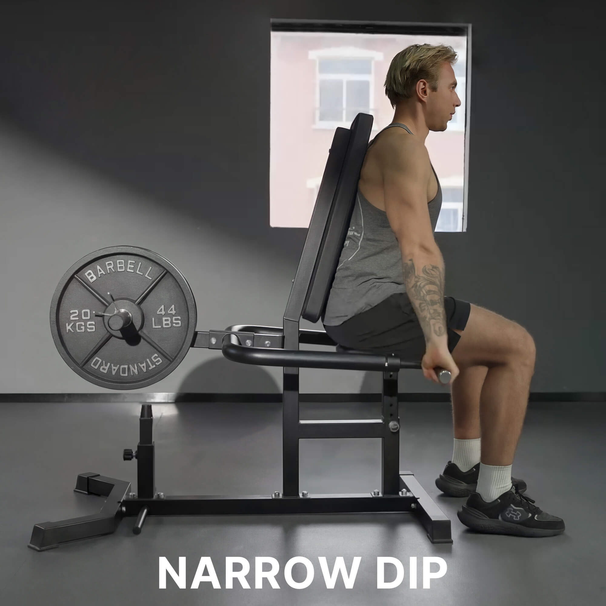 Person performing a narrow dip exercise with gym equipment in a gym setting.#color_black