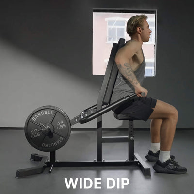 Person using a wide dip machine in a gym setting.