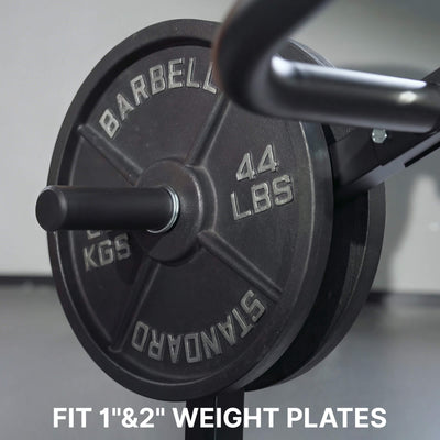 Close-up of a weight plate with 'Barbell' branding and '44 LBS' marking, on a blurred background.