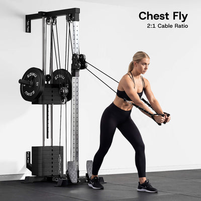 Woman exercising with a cable machine in a gym setting.