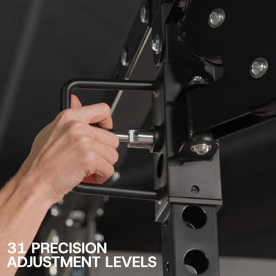 Hand making precise adjustments to a piece of gym equipment with text '31 Precision Adjustment Levels'.