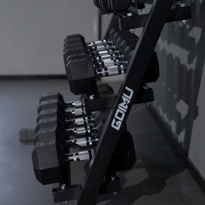 Dumbbell set on a rack with 'GOMU' branding in a gym setting.#pounds_450lbs-with-rack