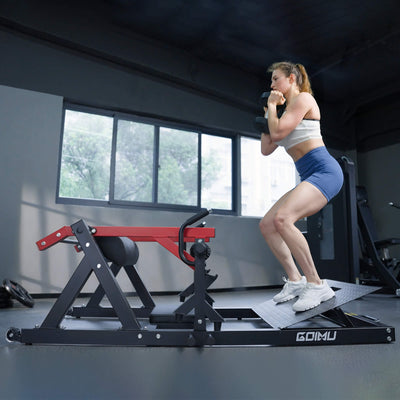 Woman exercising on a Goimu fitness machine in a gym setting.