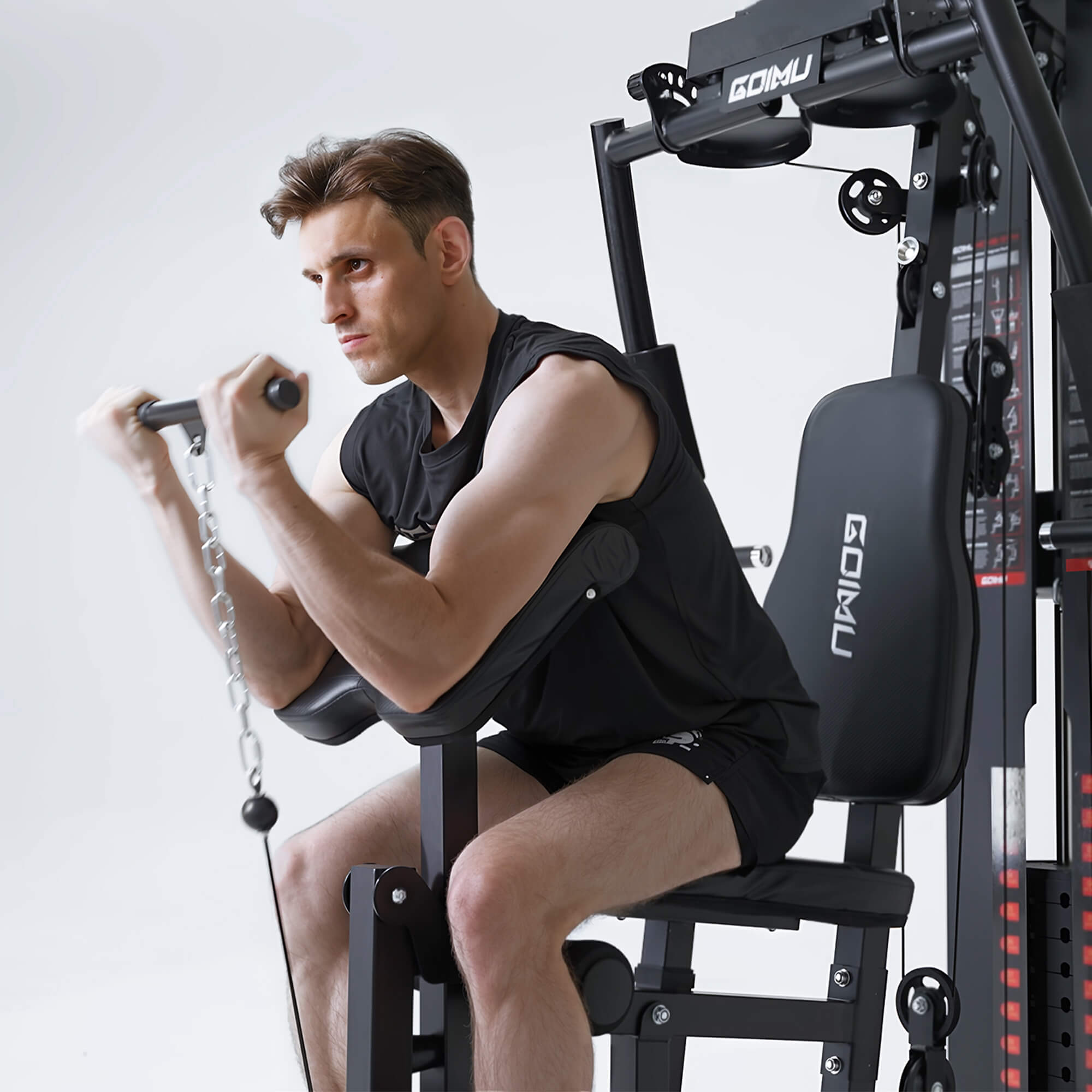 Man exercising on a GoMu fitness machine against a white background