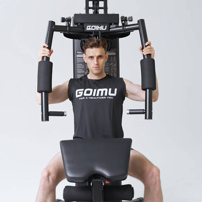 Person using a GOMU fitness machine with a plain background