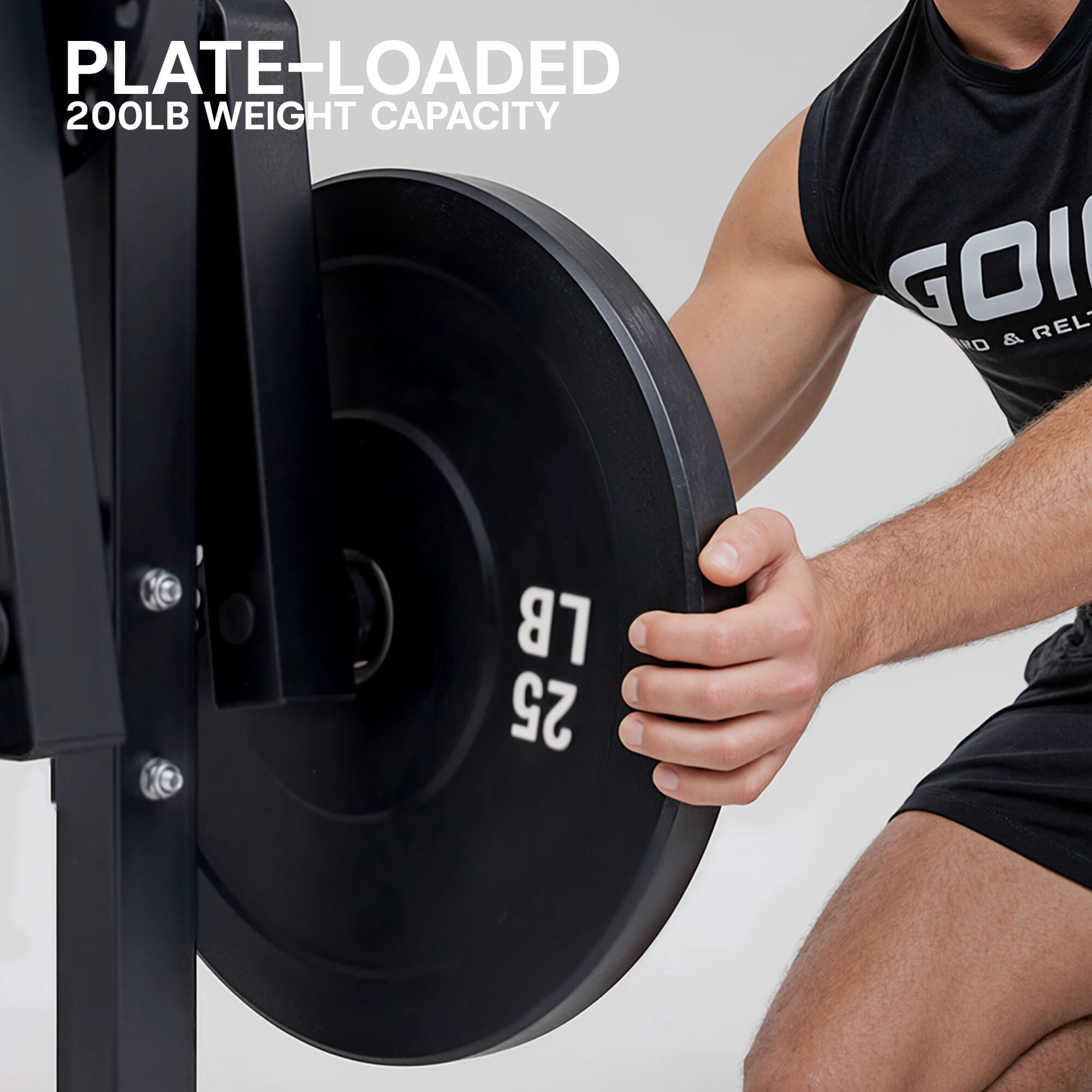 Person holding a 25-pound weight plate with 'GOLD' visible on their shirt, against a white background.#color_black