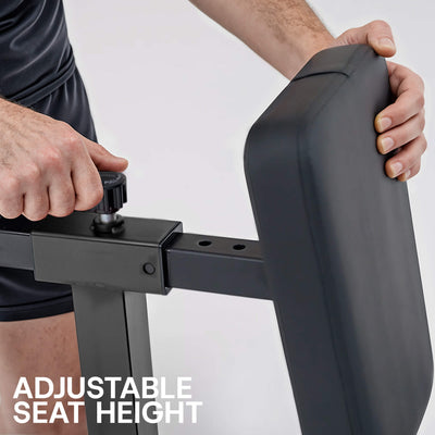 Person adjusting the seat height of a stationary bike with text 'Adjustable Seat Height'.