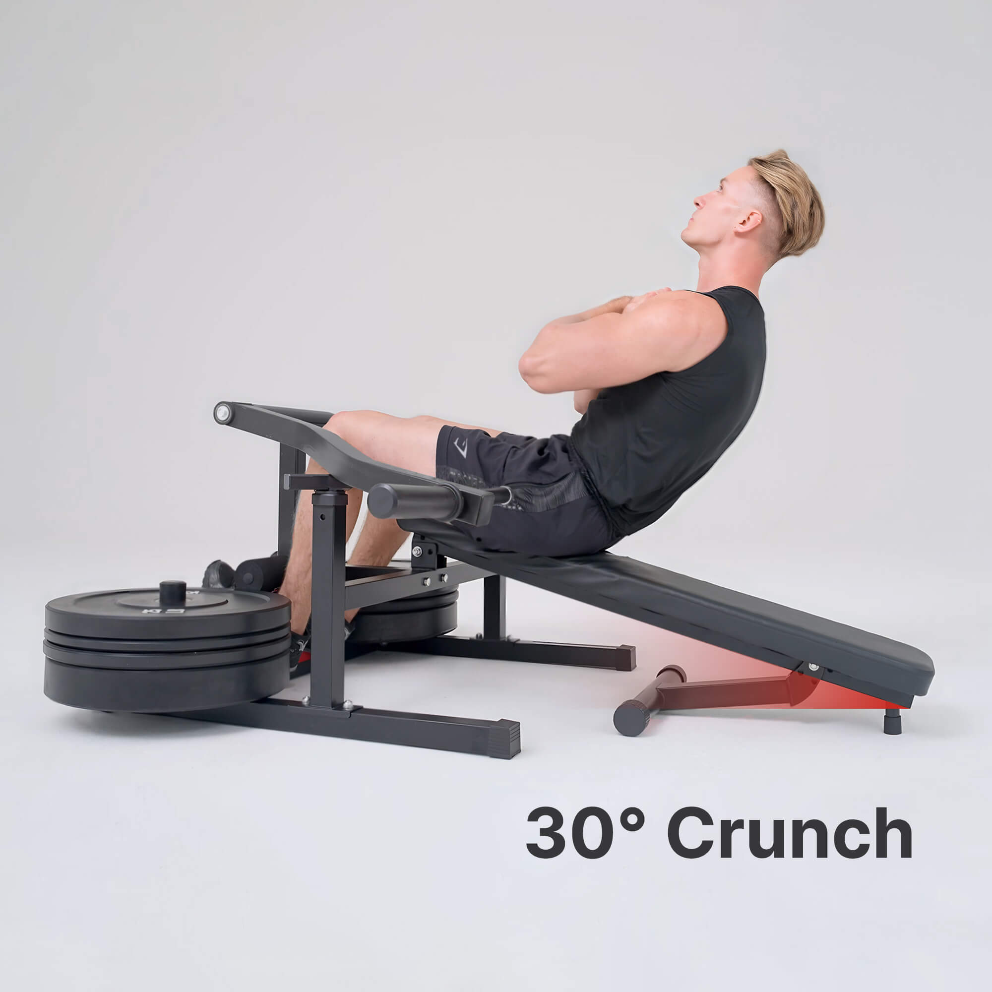 Person using a weight bench for a 30-degree crunch exercise on a plain background.#color_black