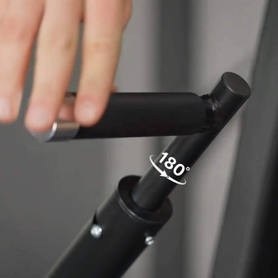 Black bicycle handlebar with a hand gripping it, showing a 180-degree rotation.