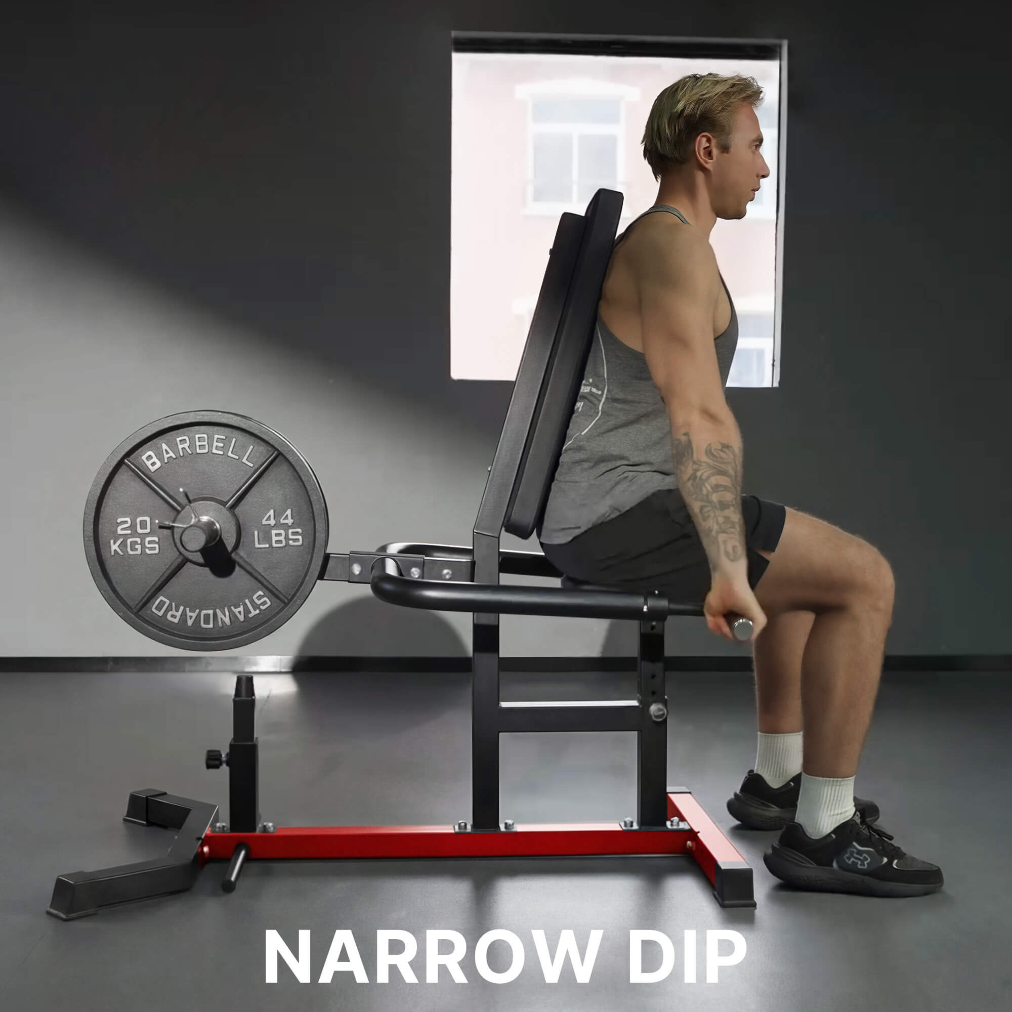 Man performing a narrow dip exercise with a weight bench in a gym setting.
