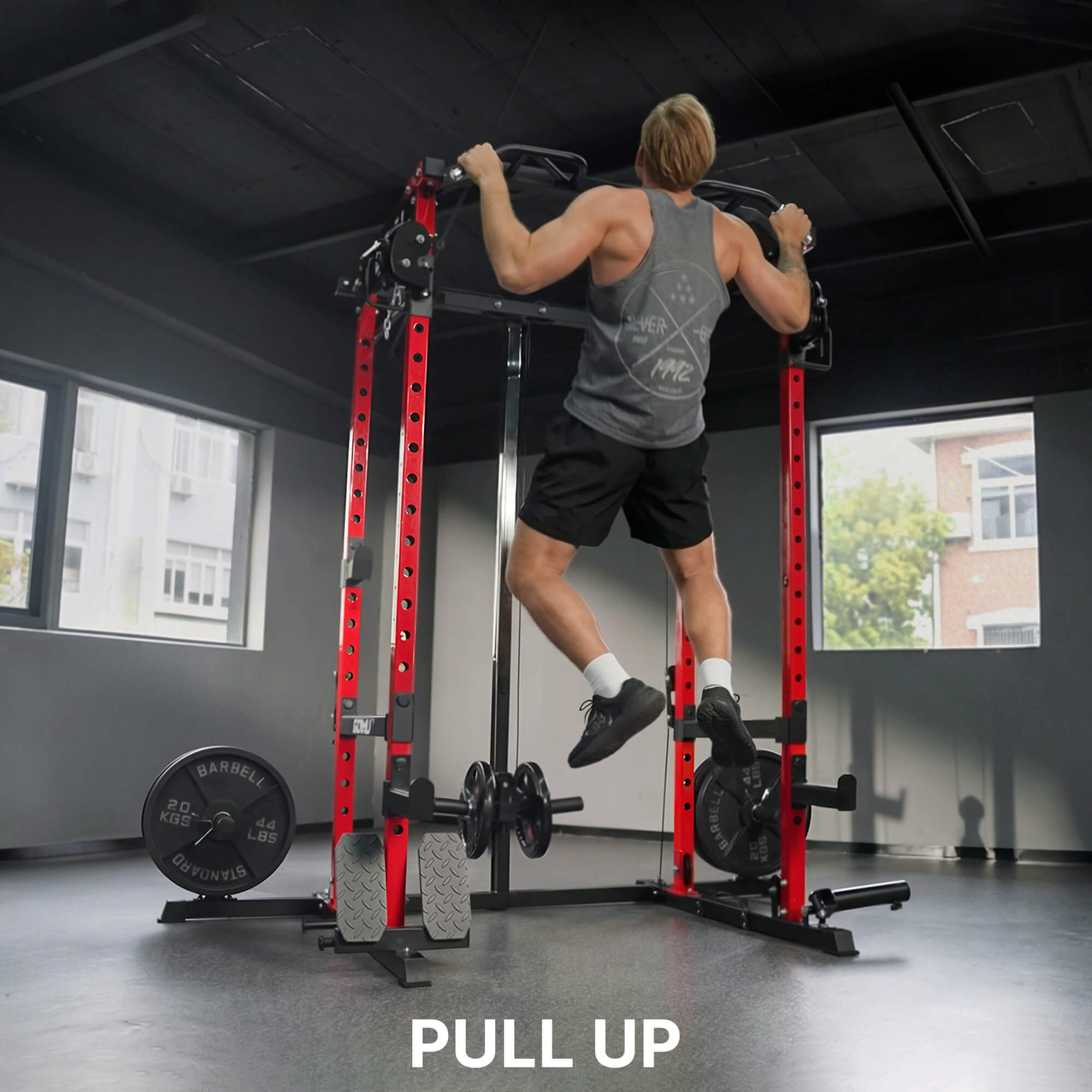 Person using a pull-up bar in a gym setting with 'PULL UP' text displayed.