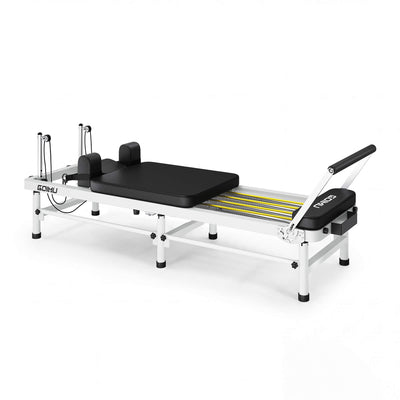 Pilates reformer machine on a white background