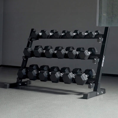 Black dumbbell rack with hexagonal dumbbells on a gray floor.#pounds_550lbs-with-rack