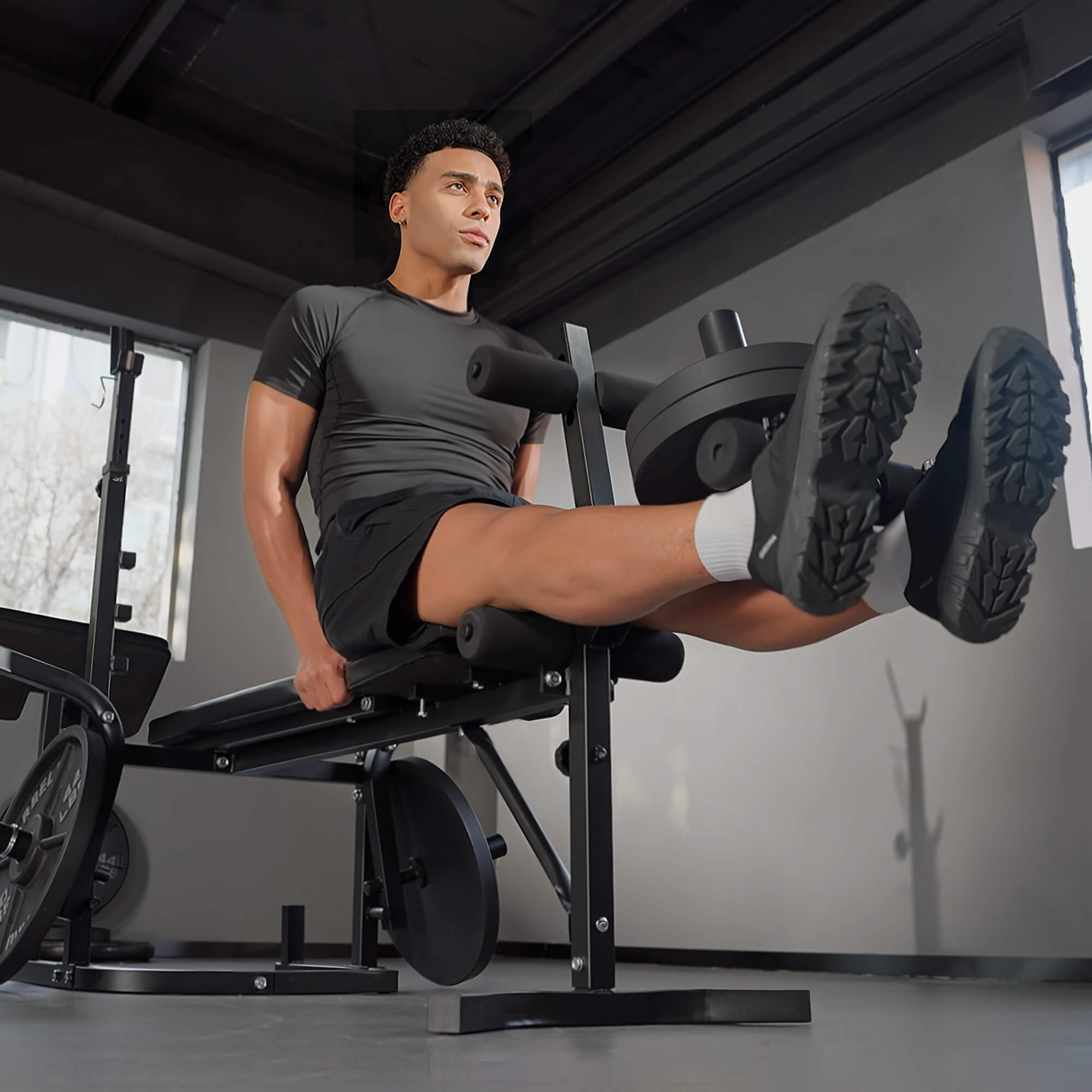 Man exercising on a leg press machine in a gym setting