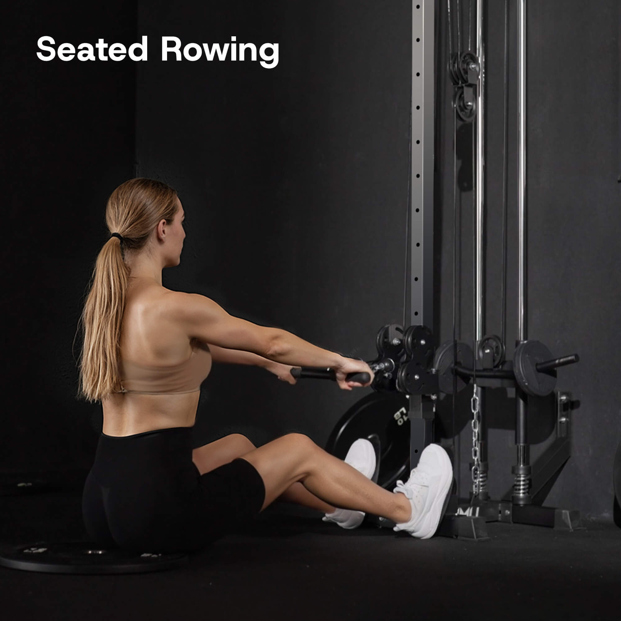 Person using a seated rowing machine in a gym setting with 'Seated Rowing' text above.